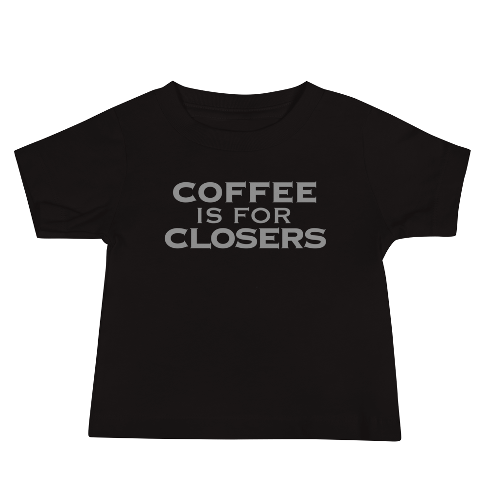 "Coffee Is For Closers" printed on a black baby jersey short sleeve tee laying on a flat surface
