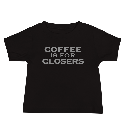 "Coffee Is For Closers" printed on a black baby jersey short sleeve tee laying on a flat surface