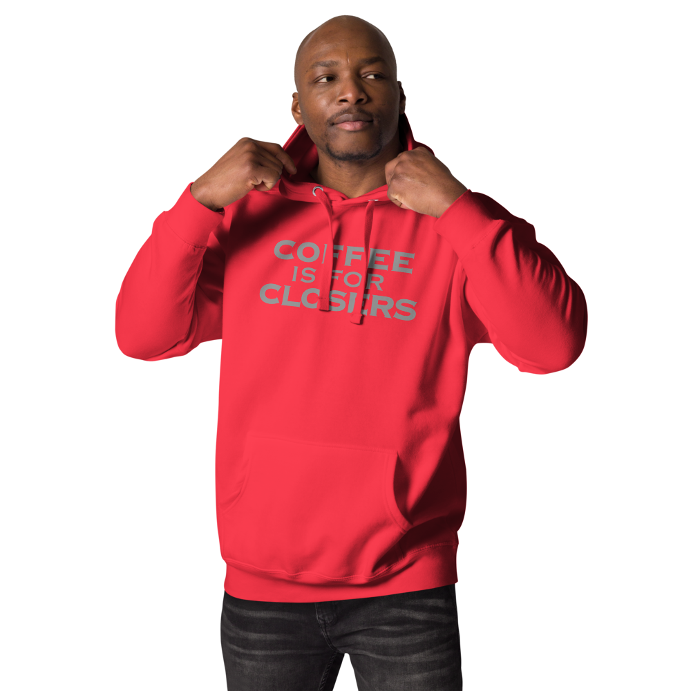 "Coffee Is For Closers" printed on a team red unisex hoodie worn by a male
