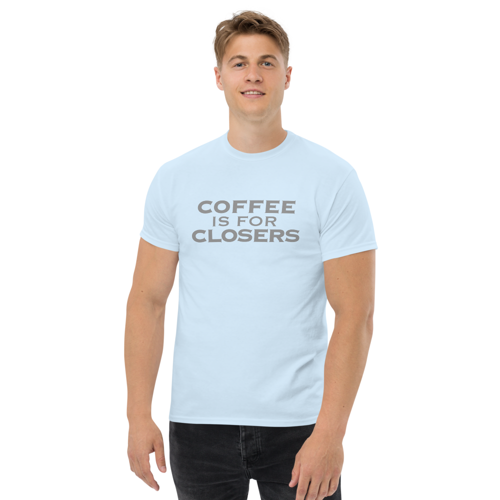 "Coffee Is For Closers" printed on a light blue unisex classic tee worn by a male