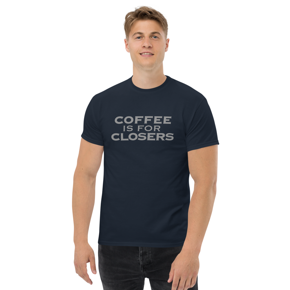 "Coffee Is For Closers" printed on a navy unisex classic tee worn by a male
