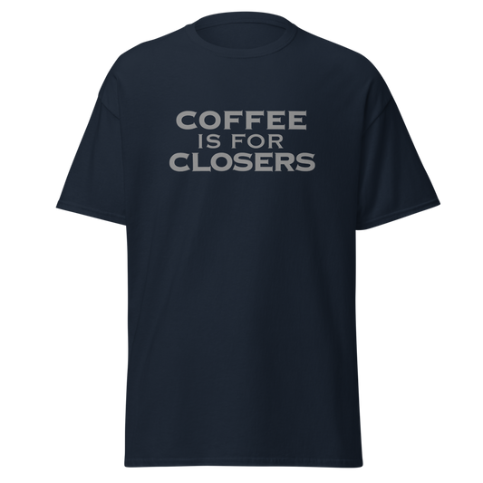 "Coffee Is For Closers" printed on a navy unisex classic tee laying on a flat surface