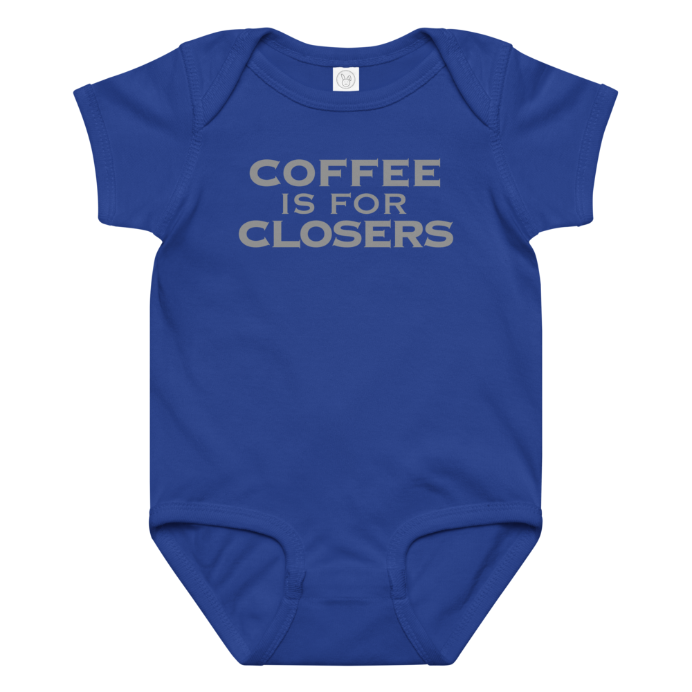 "Coffee Is For Closers" printed on a royal baby jersey bodysuit laying on a flat surface amongst other clothes