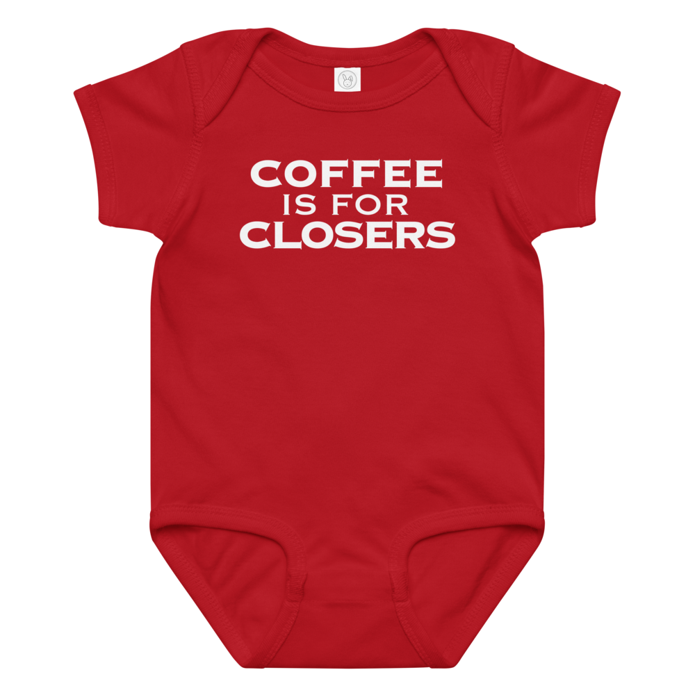"Coffee Is For Closers" printed on a red baby jersey bodysuit laying on a flat surface amongst other clothes