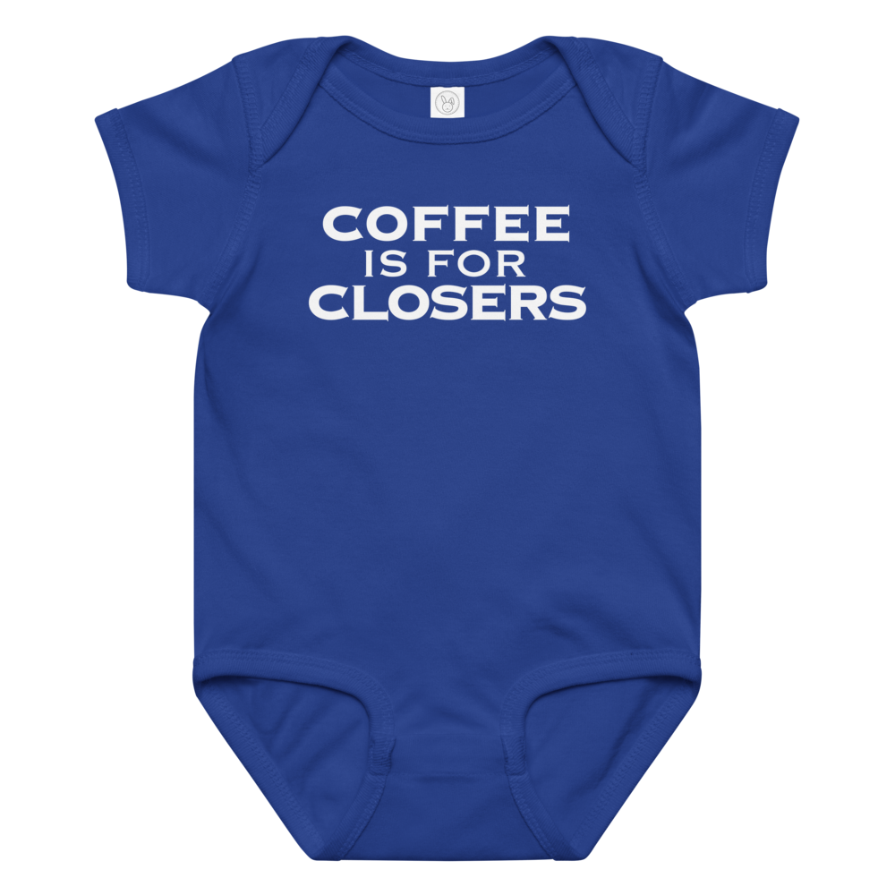 "Coffee Is For Closers" printed on a royal baby jersey bodysuit laying on a flat surface amongst other clothes