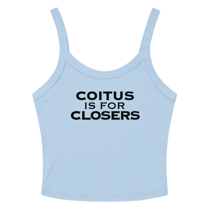 "Coitus Is For Closers" printed on a solid baby blue blend women's micro-rib tanktop laying on a flat surface amongst sunglasses and shorts