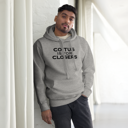 "Coitus Is For Closers" printed on a carbon grey unisex hoodie worn by a male