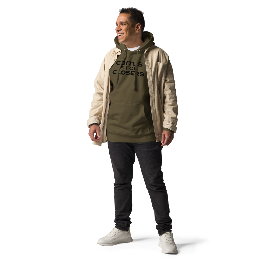 "Coitus Is For Closers" printed on a military green unisex hoodie worn by a male with a jacket on top