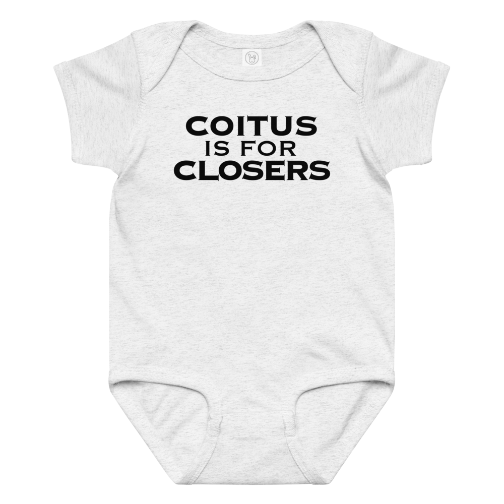 "Coitus Is For Closers" printed on a ash baby jersey bodysuit laying on a flat surface amongst other clothes