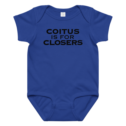 "Coitus Is For Closers" printed on a royal baby jersey bodysuit laying on a flat surface amongst other clothes