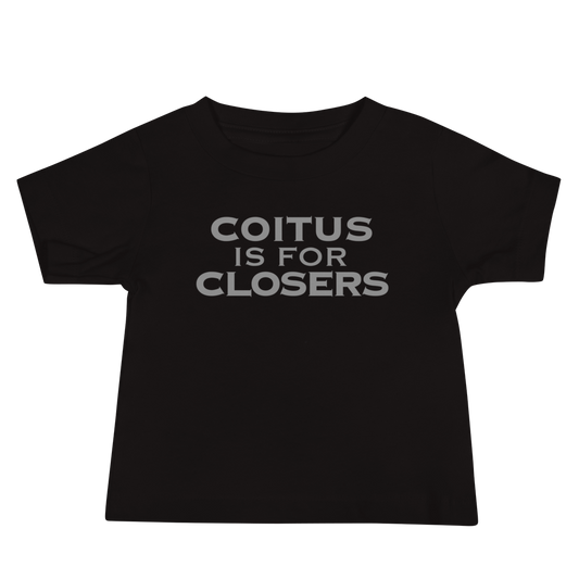 "Coitus Is For Closers" printed on a black baby jersey short sleeve tee laying on a flat surface