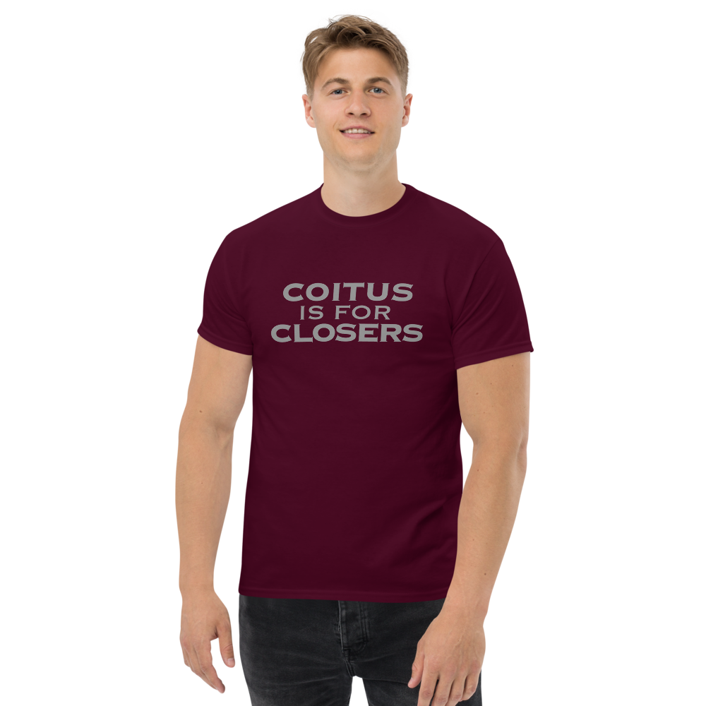 "Coitus Is For Closers" printed on a maroon unisex classic tee worn by a male