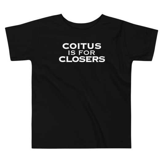 "Coitus Is For Closers" printed on a black toddler short sleeve tee laying on a flat surface