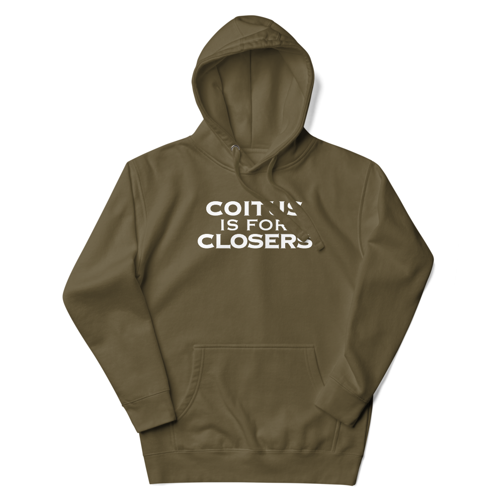 "Coitus Is For Closers" printed on a military green unisex hoodie laying on a flat surface with the hood up