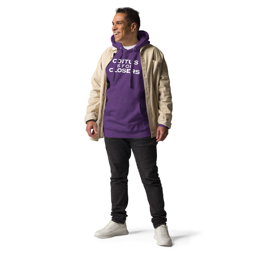 "Coitus Is For Closers" printed on a purple unisex hoodie worn by a male with a jacket on top