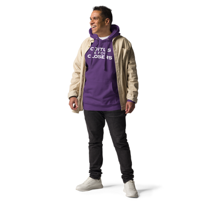 "Coitus Is For Closers" printed on a purple unisex hoodie worn by a male with a jacket on top