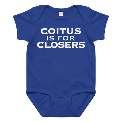 "Coitus Is For Closers" printed on a royal baby jersey bodysuit laying on a flat surface amongst other clothes