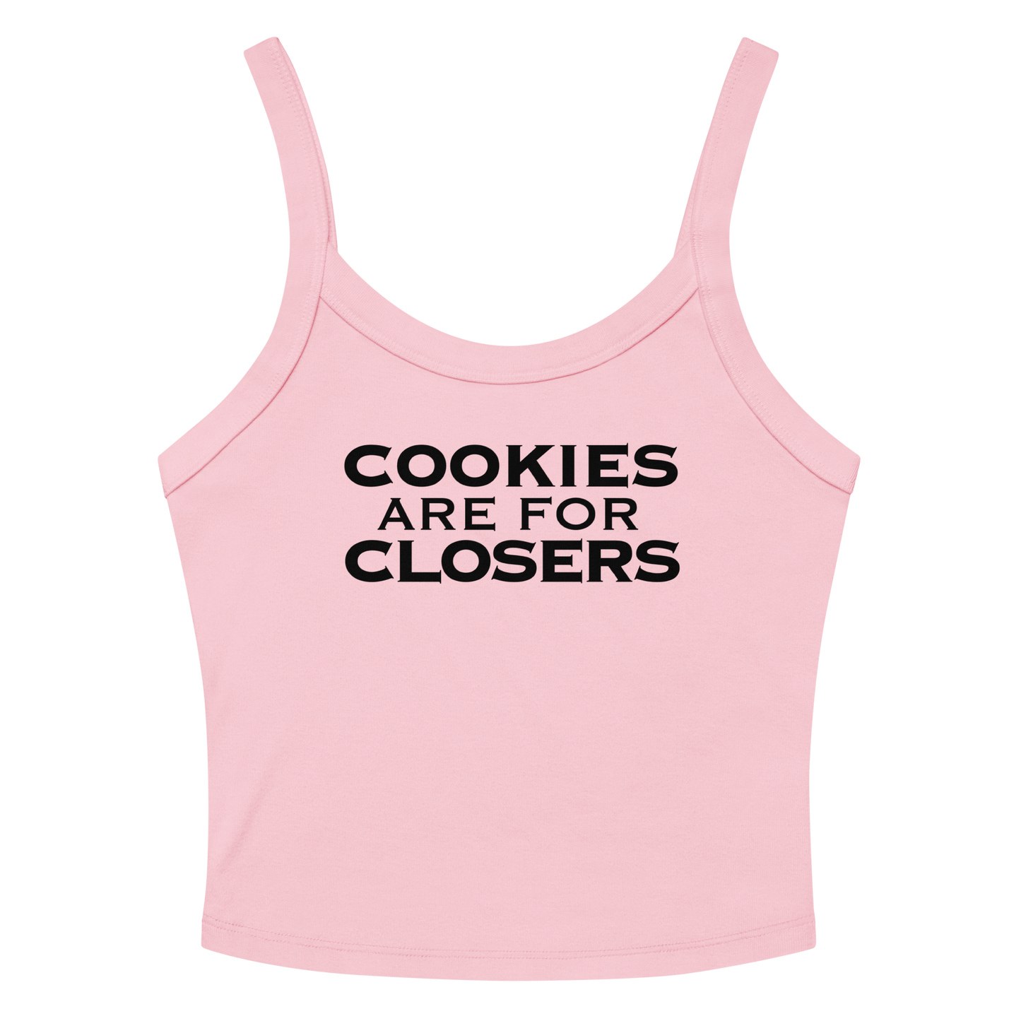 "Cookies Are For Closers" printed on a solid pink blend women's micro-rib tanktop laying on a flat surface amongst sunglasses and shorts
