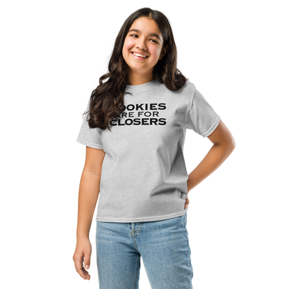"Cookies Are For Closers" printed on a sport grey youth classic tee worn by a female
