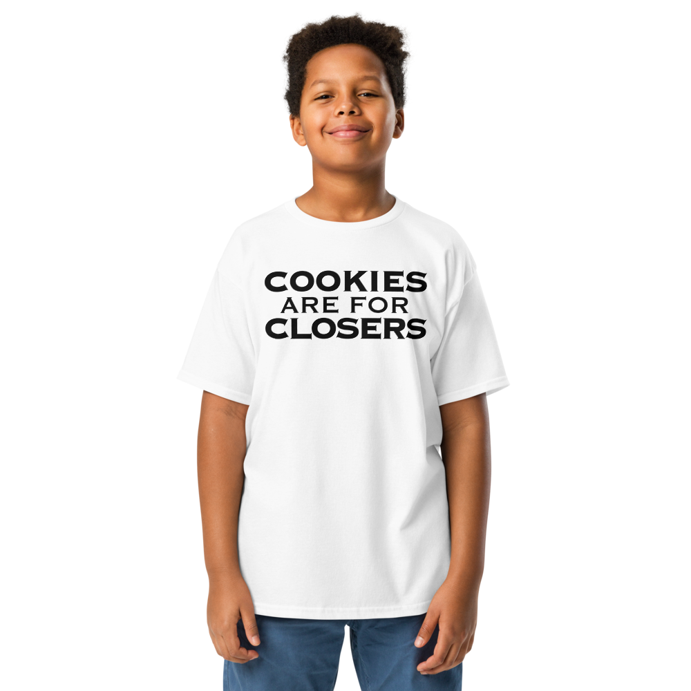 "Cookies Are For Closers" printed on a white youth classic tee worn by a male