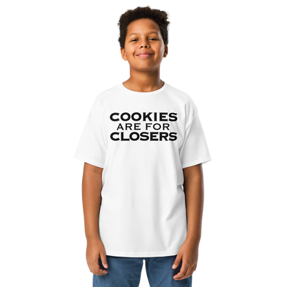 "Cookies Are For Closers" printed on a white youth classic tee worn by a male