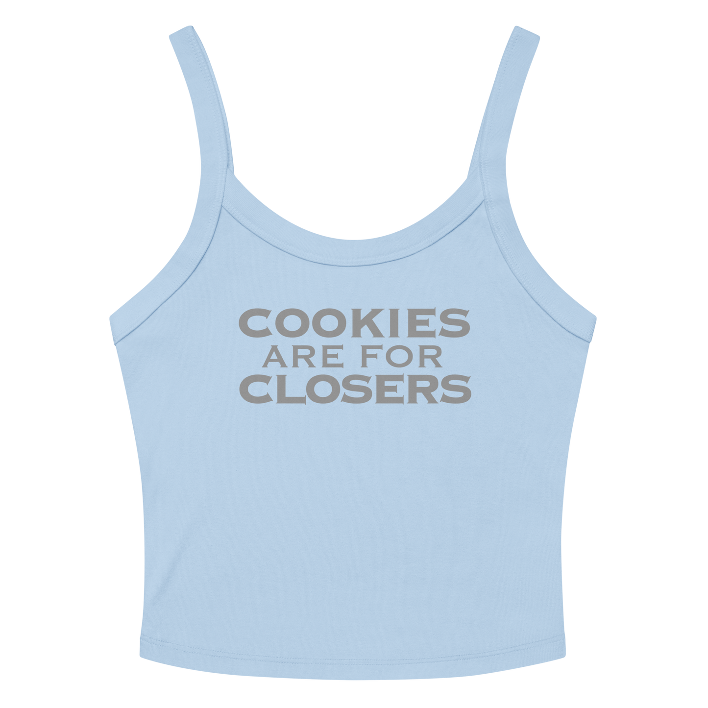 "Cookies Are For Closers" printed on a solid baby blue blend women's micro-rib tanktop laying on a flat surface amongst sunglasses and shorts