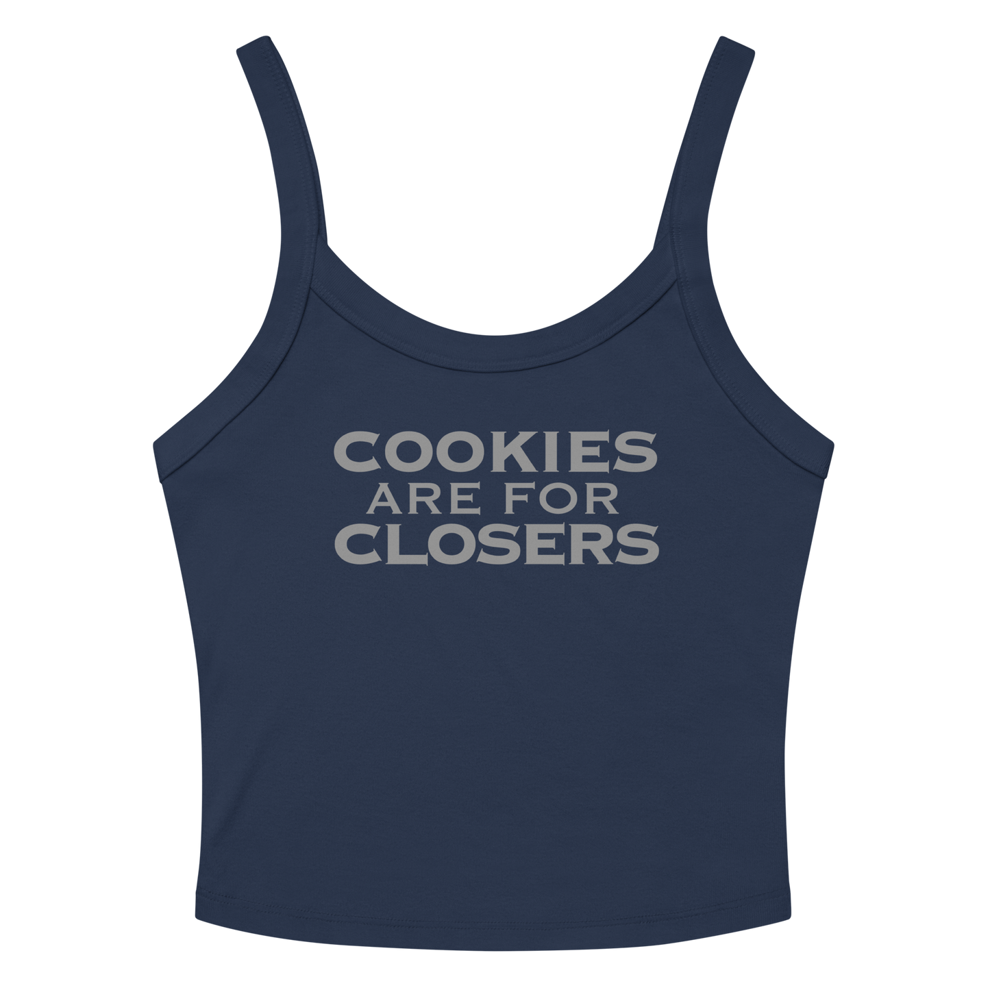 "Cookies Are For Closers" printed on a solid navy blend women's micro-rib tanktop laying on a flat surface amongst sunglasses and shorts