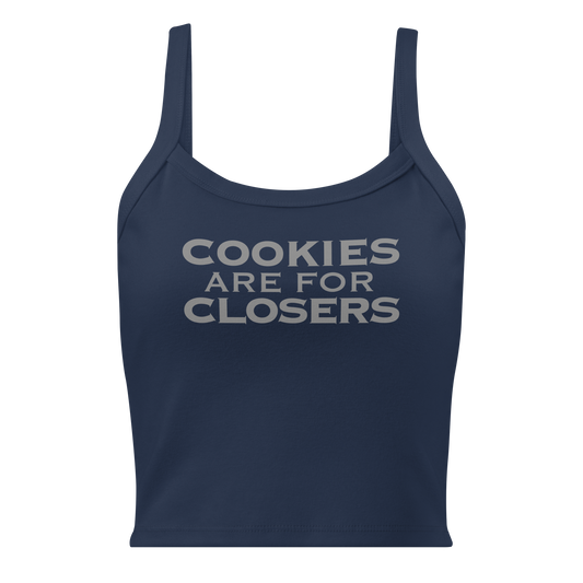 "Cookies Are For Closers" printed on a solid navy blend women's micro-rib tanktop laying on a flat surface