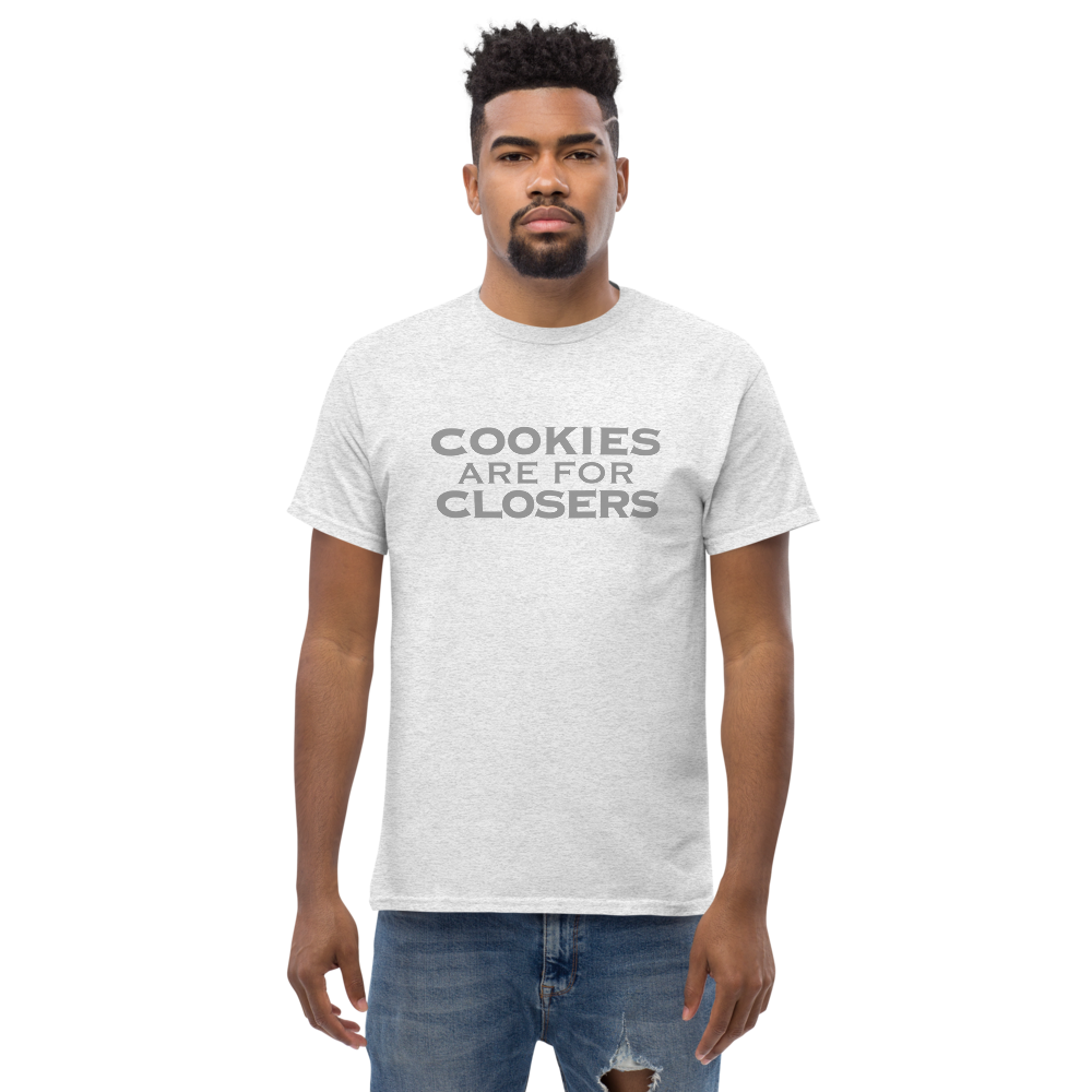 "Cookies Are For Closers" printed on a ash unisex classic tee worn by a male