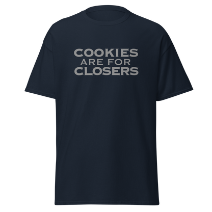 "Cookies Are For Closers" printed on a navy unisex classic tee laying on a flat surface