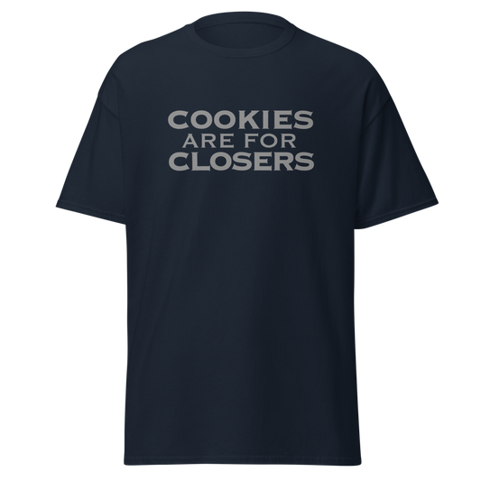 "Cookies Are For Closers" printed on a navy unisex classic tee laying on a flat surface