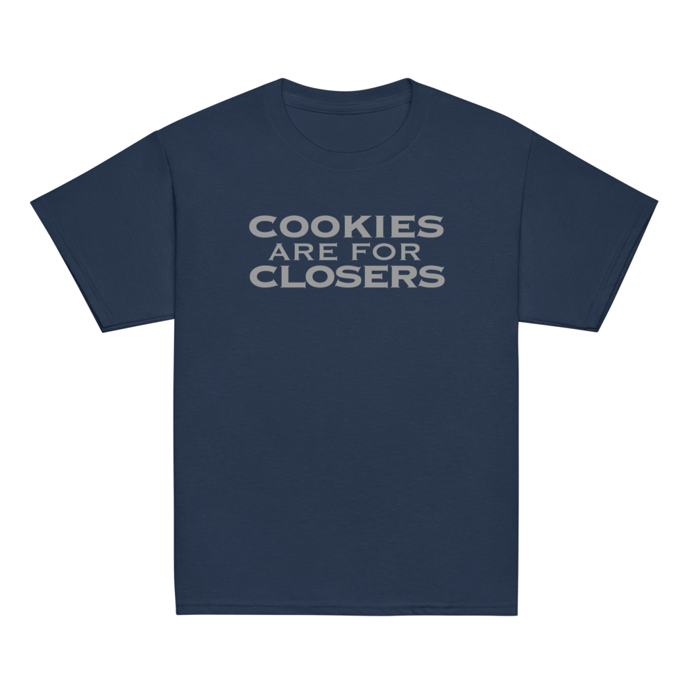 "Cookies Are For Closers" printed on a navy youth classic tee laying on a flat surface