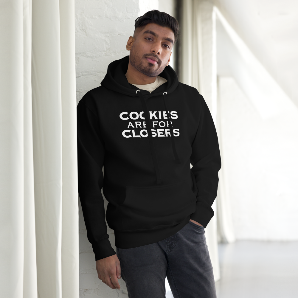 "Cookies Are For Closers" printed on a black unisex hoodie worn by a male