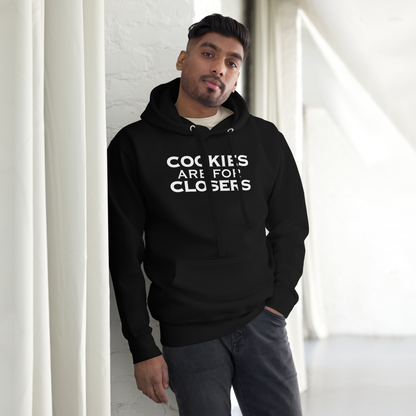 "Cookies Are For Closers" printed on a black unisex hoodie worn by a male
