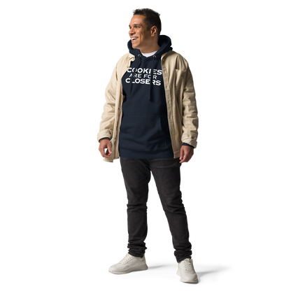 "Cookies Are For Closers" printed on a navy blazer unisex hoodie worn by a male with a jacket on top