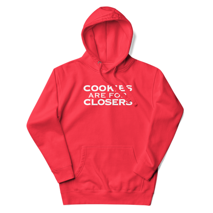 "Cookies Are For Closers" printed on a team red unisex hoodie laying on a flat surface with the hood up