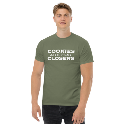 "Cookies Are For Closers" printed on a military green unisex classic tee worn by a male