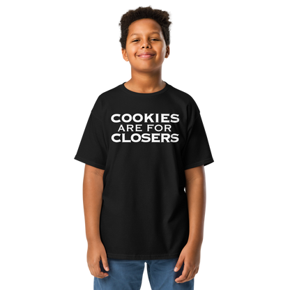 "Cookies Are For Closers" printed on a black youth classic tee worn by a male