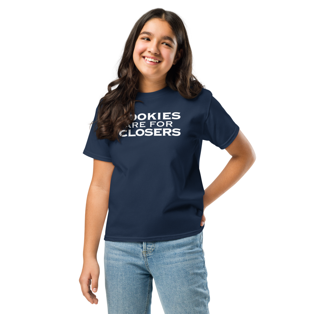 "Cookies Are For Closers" printed on a navy youth classic tee worn by a female