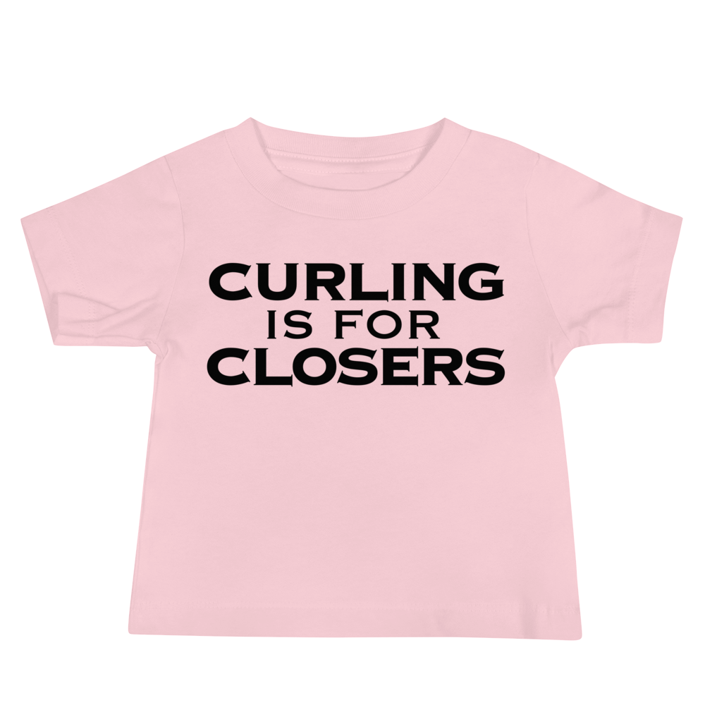 "Curling Is For Closers" printed on a pink baby jersey short sleeve tee laying on a flat surface