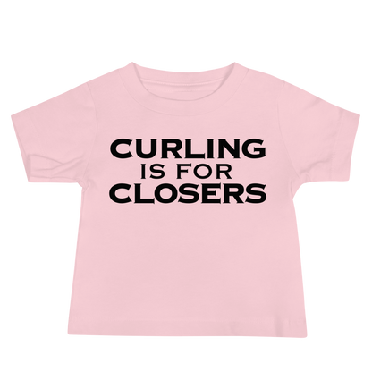 "Curling Is For Closers" printed on a pink baby jersey short sleeve tee laying on a flat surface