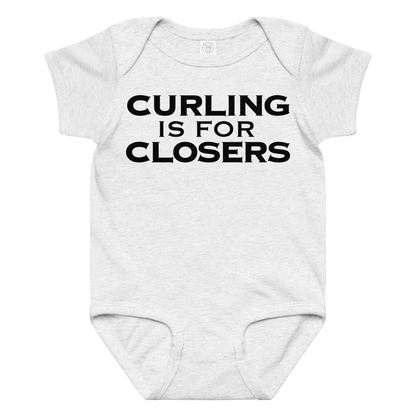 "Curling Is For Closers" printed on a ash baby jersey bodysuit laying on a flat surface amongst other clothes