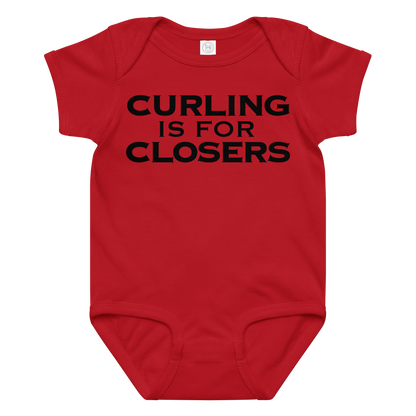 "Curling Is For Closers" printed on a red baby jersey bodysuit laying on a flat surface amongst other clothes