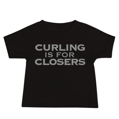 "Curling Is For Closers" printed on a black baby jersey short sleeve tee laying on a flat surface