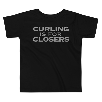 "Curling Is For Closers" printed on a black toddler short sleeve tee laying on a flat surface