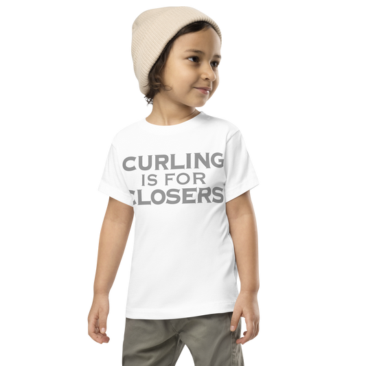 "Curling Is For Closers" printed on a white toddler short sleeve tee worn by a male wearing a cap
