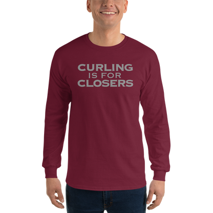 "Curling Is For Closers" printed on a maroon men's long sleeve shirt worn by a male