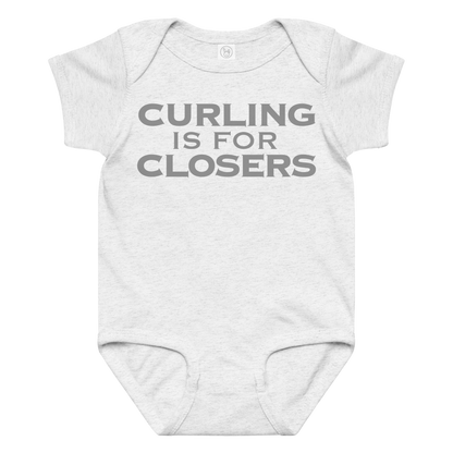 "Curling Is For Closers" printed on a ash baby jersey bodysuit laying on a flat surface amongst other clothes