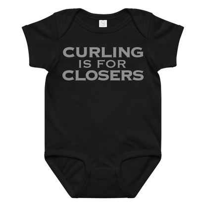 "Curling Is For Closers" printed on a black baby jersey bodysuit laying on a flat surface amongst other clothes