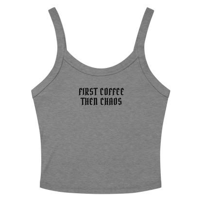 "First Coffee  Then Chaos" printed on a athletic heather women's micro-rib tanktop laying on a flat surface amongst sunglasses and shorts